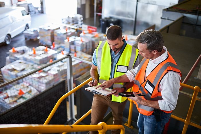 Logistics professionals reviewing transportation plans